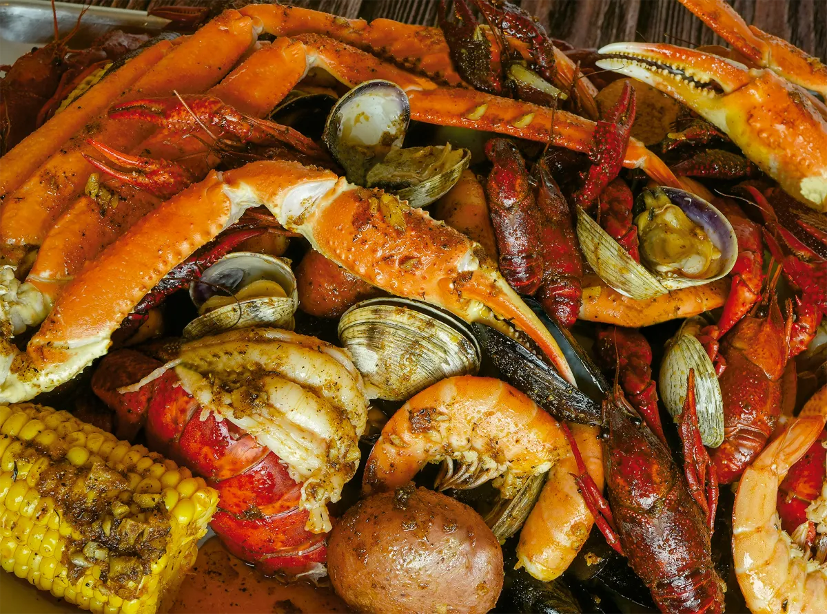Seafood boil spread with snow crab, clams, shrimp and corn